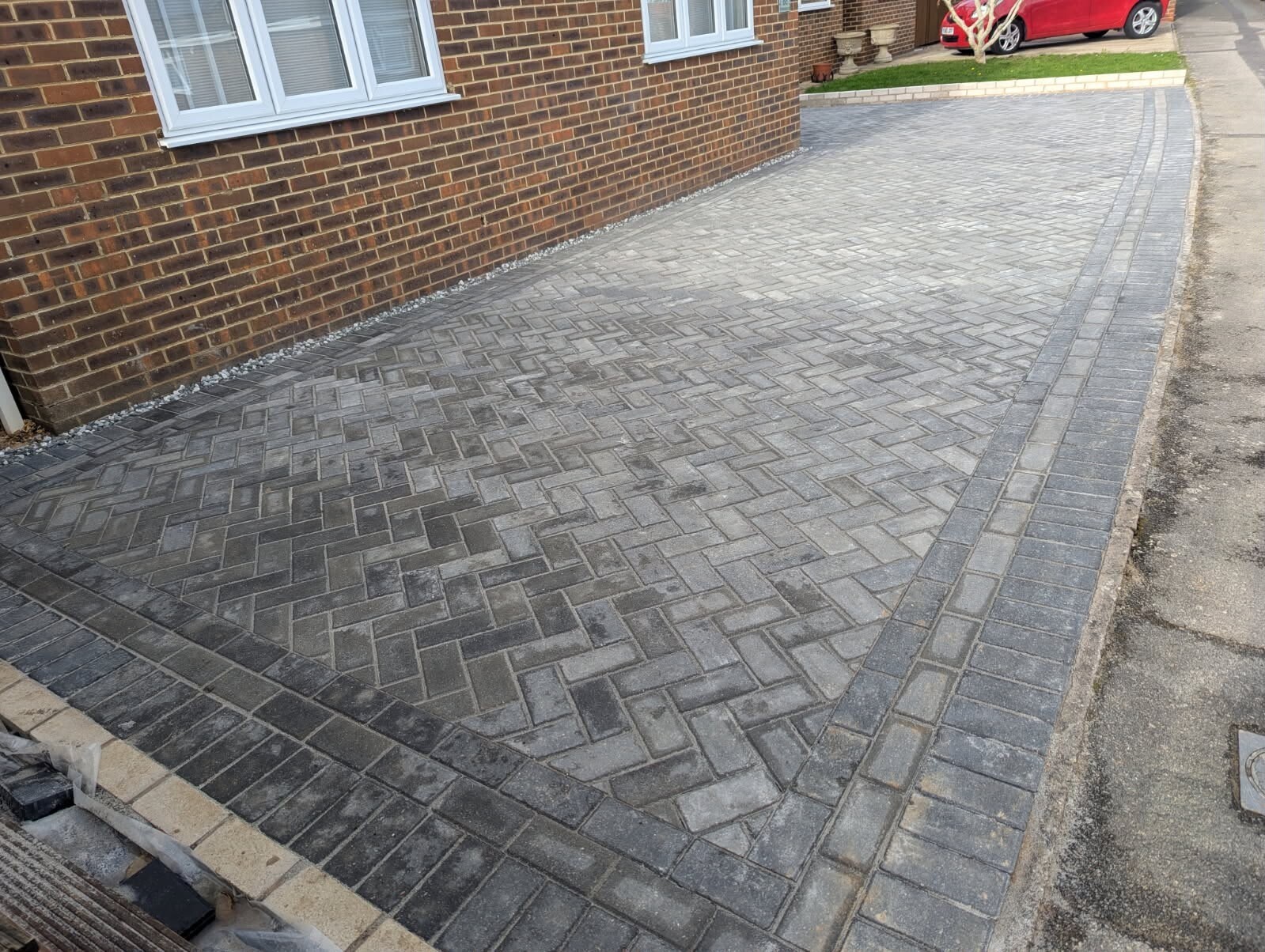 Herringbone block paving driveway with a clean edge course at a Sussex property.